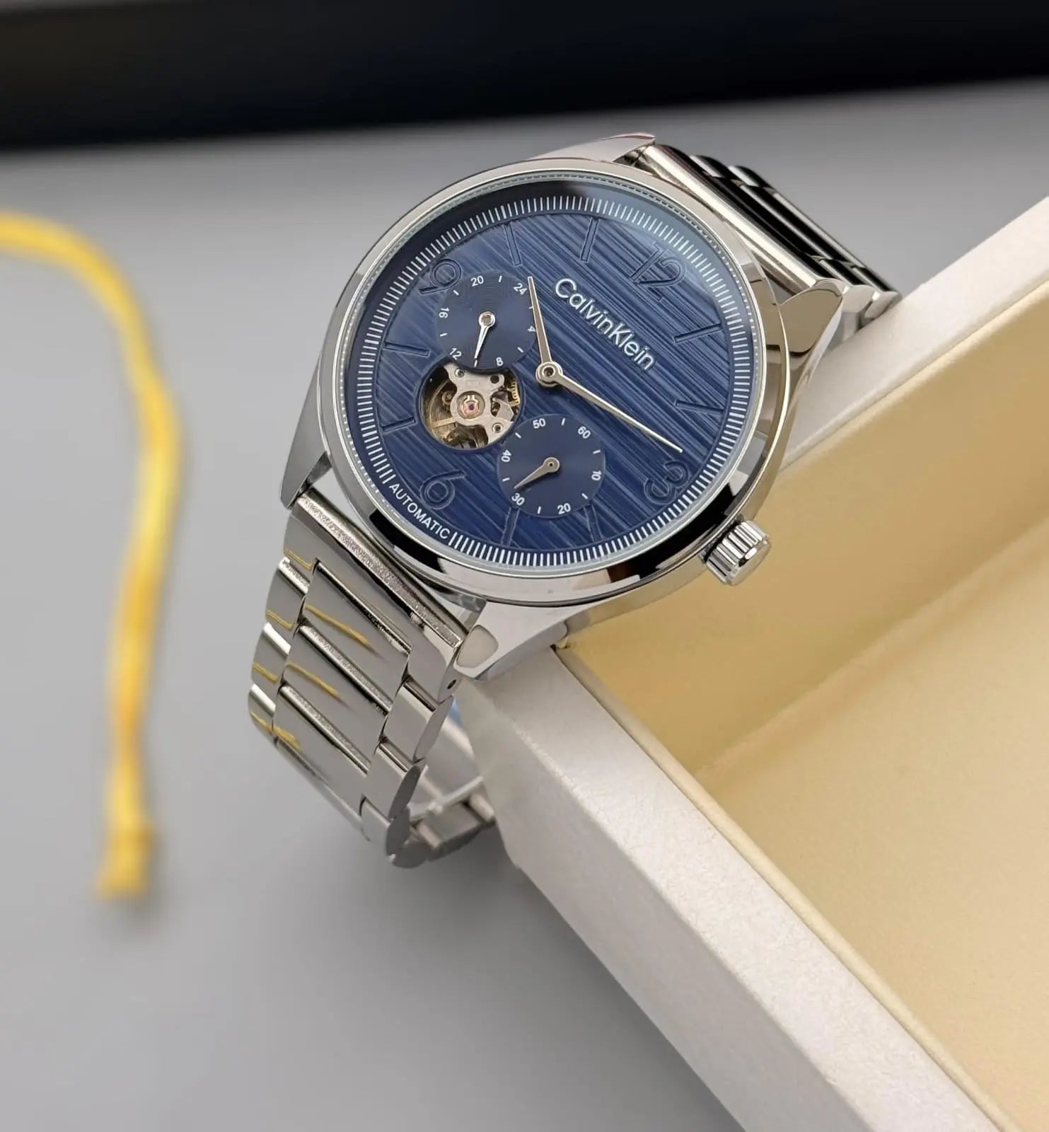 Men’s Calvin Klein Silver Automatic Watch – White Dial | GreatIndiaCart greatindiacart.com