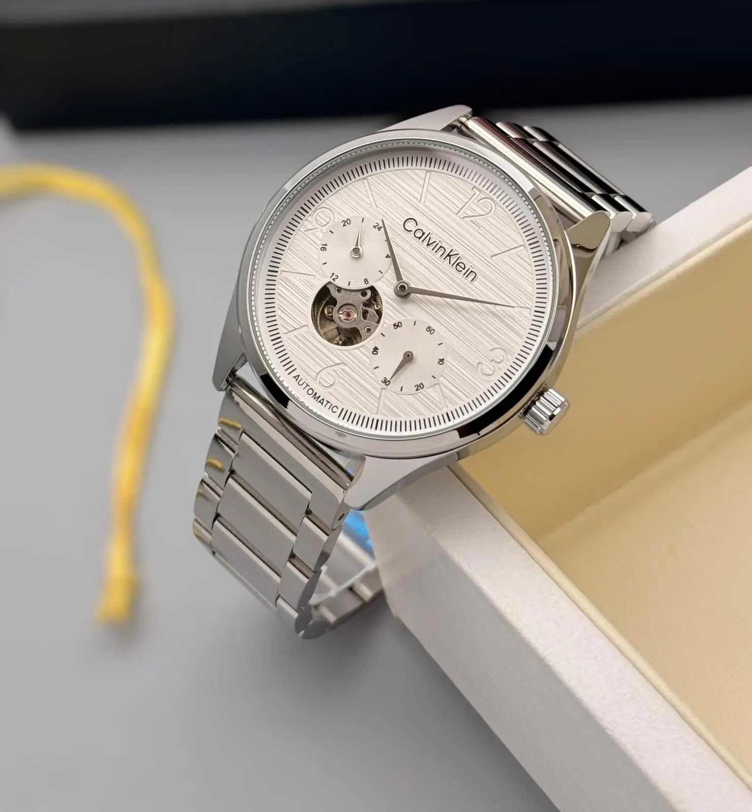 Men’s Calvin Klein Silver Automatic Watch – White Dial | GreatIndiaCart greatindiacart.com